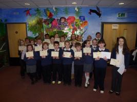 Pupils of Deri View school proudly showing the certificates they received for taking part in the Rotary Young Writer competition.